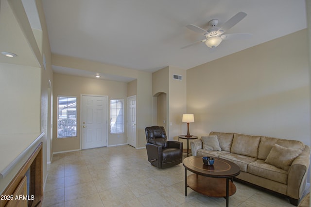 living room featuring ceiling fan and light tile patterned floors