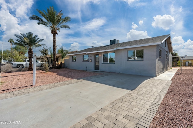 ranch-style house with cooling unit