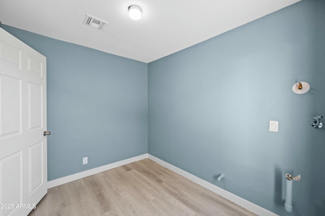 spare room featuring light hardwood / wood-style flooring