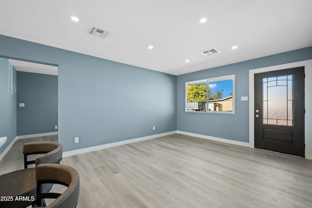 entryway with light hardwood / wood-style flooring