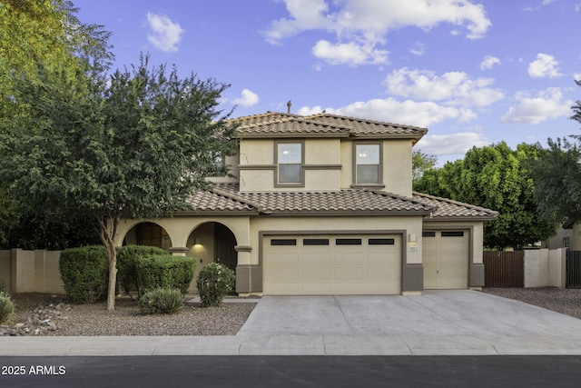 1953 E Lafayette Ave, Gilbert, AZ 85298 - mediterranean / spanish-style home with concrete driveway, a tile roof, stucco siding, and an attached garage