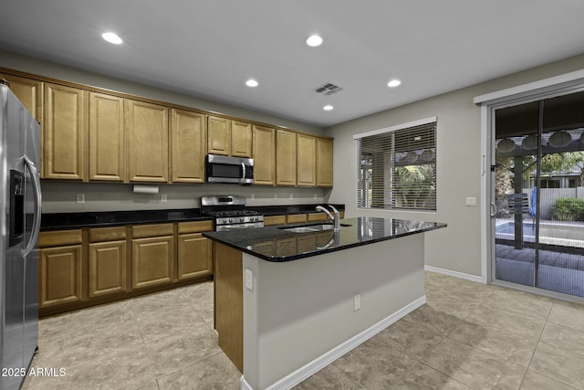 1953 E Lafayette Ave, Gilbert, AZ 85298 - kitchen featuring stainless steel appliances, an island with sink, dark stone counters, recessed lighting, and light tile patterned floors