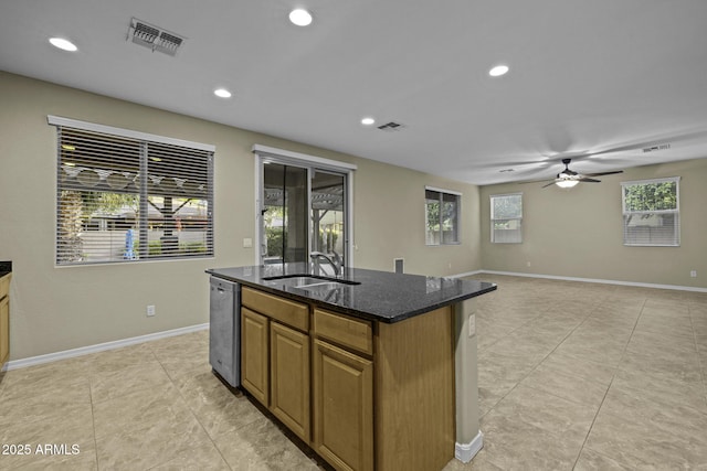 1953 E Lafayette Ave, Gilbert, AZ 85298 - kitchen with a kitchen island with sink, light tile patterned floors, ceiling fan, dark stone countertops, and recessed lighting
