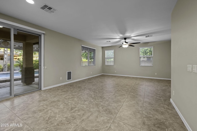 1953 E Lafayette Ave, Gilbert, AZ 85298 - tiled empty room featuring ceiling fan and baseboards
