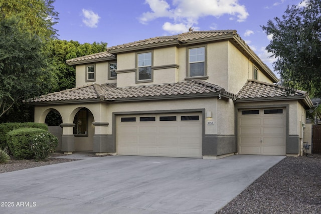 1953 E Lafayette Ave, Gilbert, AZ 85298 - mediterranean / spanish-style home with driveway, stucco siding, an attached garage, and a tile roof