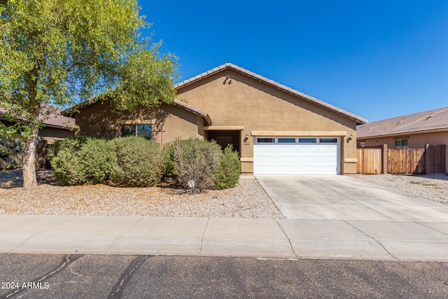 ranch-style house featuring a garage