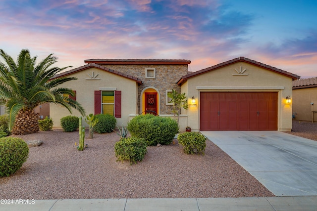 mediterranean / spanish-style house featuring a garage