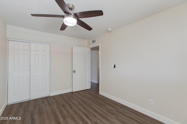 4325 W Sierra St, Glendale, AZ 85304 - unfurnished bedroom with dark wood finished floors, baseboards, a closet, and a ceiling fan