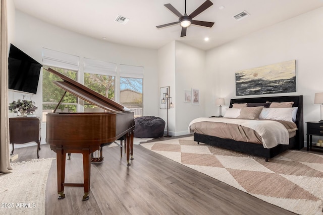 bedroom with light wood-type flooring and ceiling fan