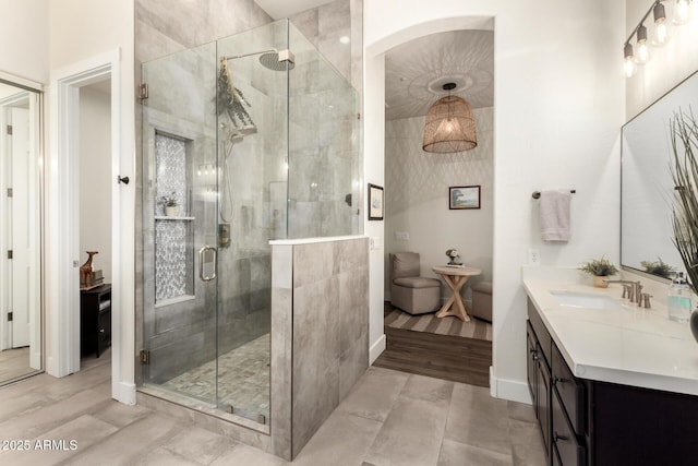 bathroom with vanity and a shower with shower door