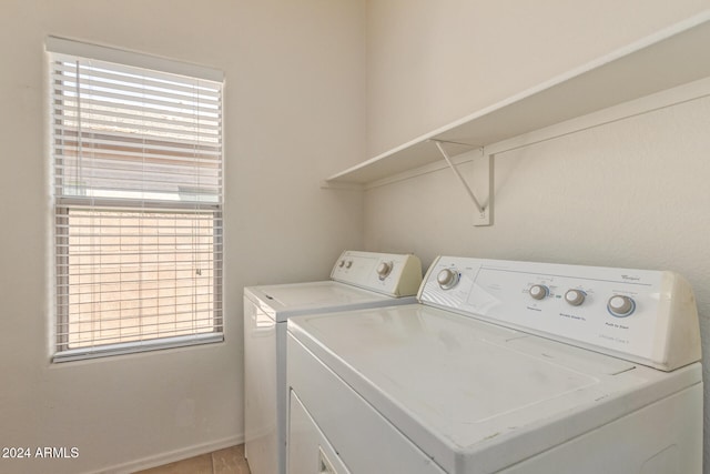 washroom featuring a healthy amount of sunlight and washer and clothes dryer