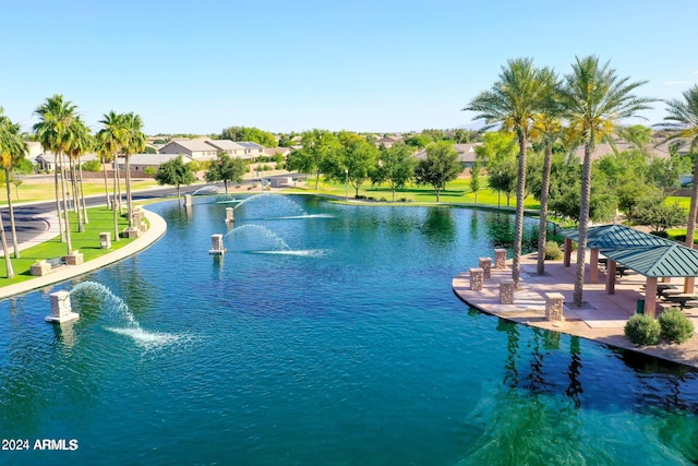 view of pool featuring a gazebo and a water view