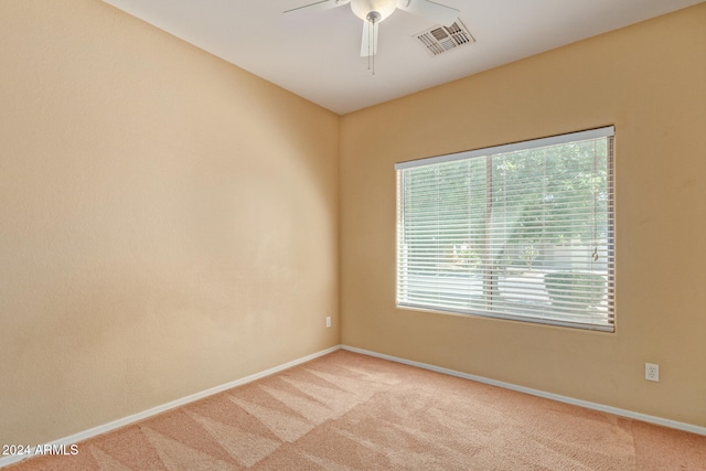 carpeted empty room with ceiling fan