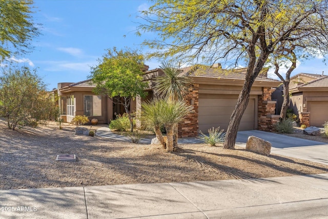 view of front of house featuring concrete driveway and an attached garage