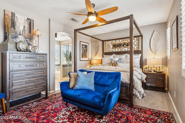13088 N 91st Dr, Peoria, AZ 85381 - carpeted bedroom featuring arched walkways and ensuite bathroom