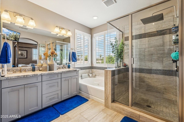 13088 N 91st Dr, Peoria, AZ 85381 - full bath featuring double vanity, a bath, and a shower stall