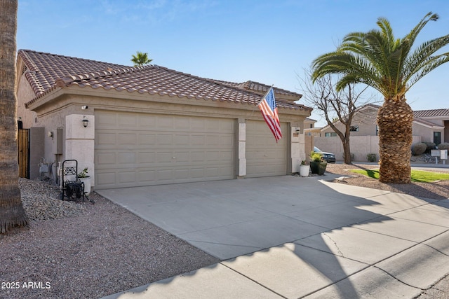 view of front of property with an attached garage, a tile roof, concrete driveway, and stucco siding