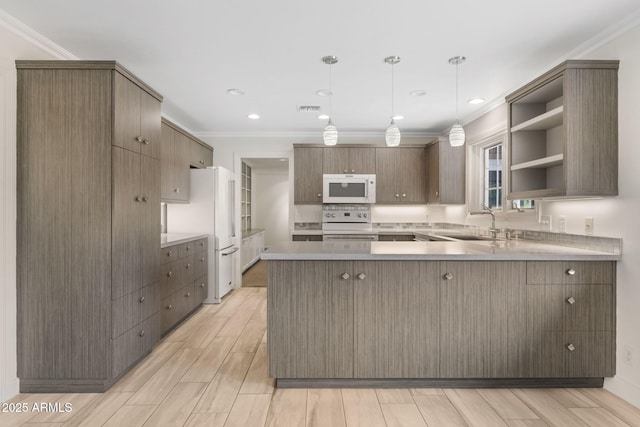 143 E Winter Dr, Phoenix, AZ 85020 - kitchen featuring white appliances, a peninsula, open shelves, ornamental molding, and light wood-type flooring