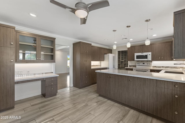 143 E Winter Dr, Phoenix, AZ 85020 - kitchen featuring white appliances, a sink, ceiling fan, light countertops, and dark brown cabinets