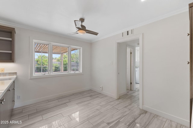 143 E Winter Dr, Phoenix, AZ 85020 - unfurnished dining area with ceiling fan, baseboards, and ornamental molding