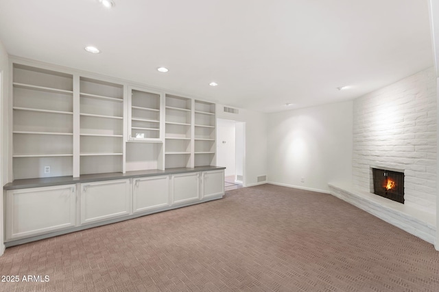 143 E Winter Dr, Phoenix, AZ 85020 - unfurnished room with a brick fireplace, carpet flooring, recessed lighting, and baseboards