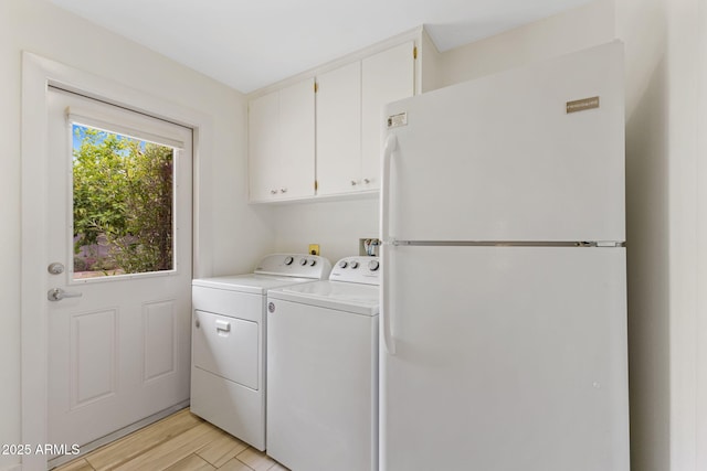143 E Winter Dr, Phoenix, AZ 85020 - washroom featuring cabinet space, washer and dryer, and light wood-type flooring