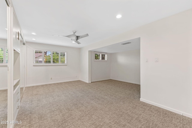 143 E Winter Dr, Phoenix, AZ 85020 - spare room featuring light carpet, plenty of natural light, recessed lighting, baseboards, and ceiling fan
