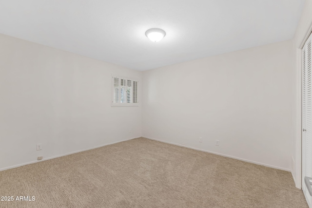 143 E Winter Dr, Phoenix, AZ 85020 - unfurnished bedroom featuring carpet flooring, a closet, and baseboards