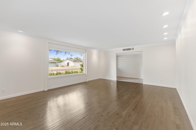 143 E Winter Dr, Phoenix, AZ 85020 - spare room featuring ornamental molding, wood finished floors, recessed lighting, and baseboards