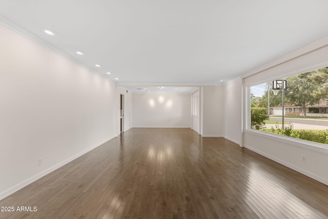 143 E Winter Dr, Phoenix, AZ 85020 - unfurnished room featuring ornamental molding, wood finished floors, baseboards, and recessed lighting