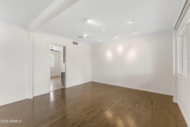 143 E Winter Dr, Phoenix, AZ 85020 - spare room featuring dark wood-style flooring, ornamental molding, and baseboards