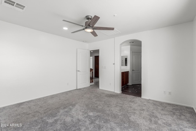 carpeted spare room featuring ceiling fan and electric panel