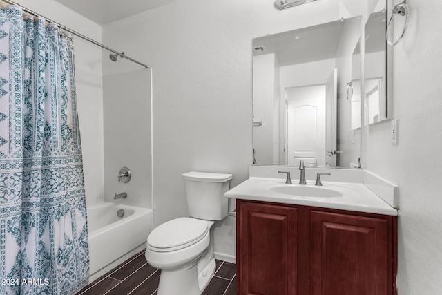 full bathroom featuring vanity, shower / bath combination with curtain, and toilet