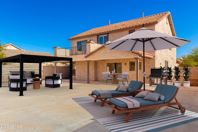 view of patio with a balcony and an outdoor hangout area