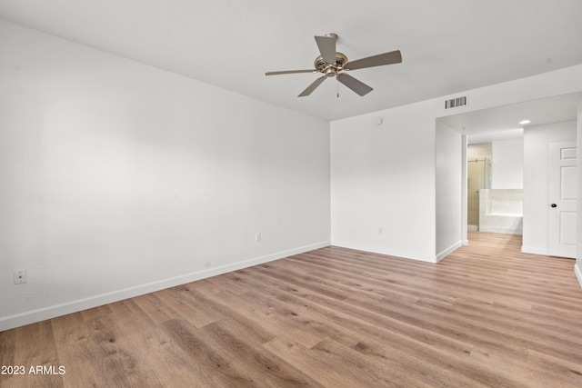 empty room featuring light wood-type flooring and ceiling fan