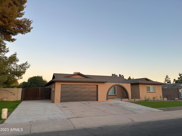 ranch-style home with a garage