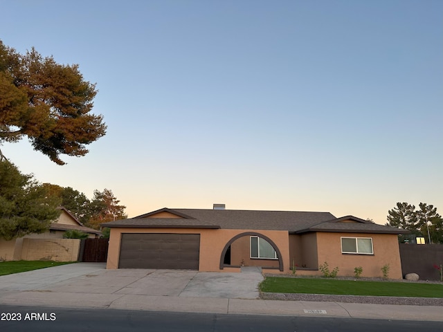 ranch-style home with a garage