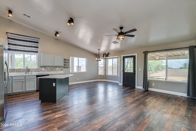 kitchen with backsplash, vaulted ceiling, dark hardwood / wood-style floors, and a healthy amount of sunlight