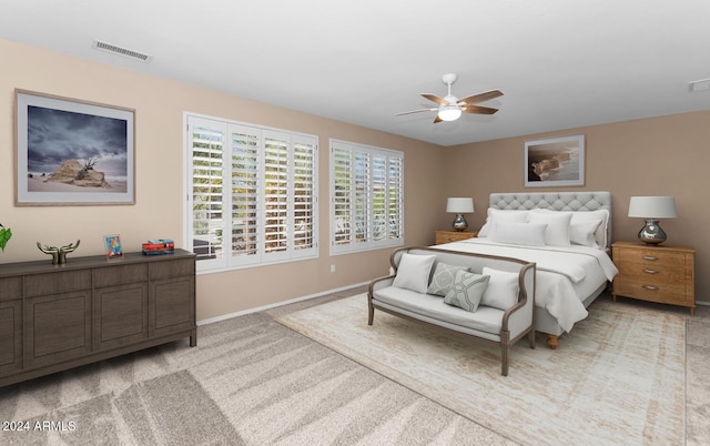 bedroom with visible vents, ceiling fan, light carpet, and baseboards