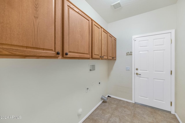 washroom featuring hookup for a washing machine, visible vents, baseboards, cabinet space, and electric dryer hookup