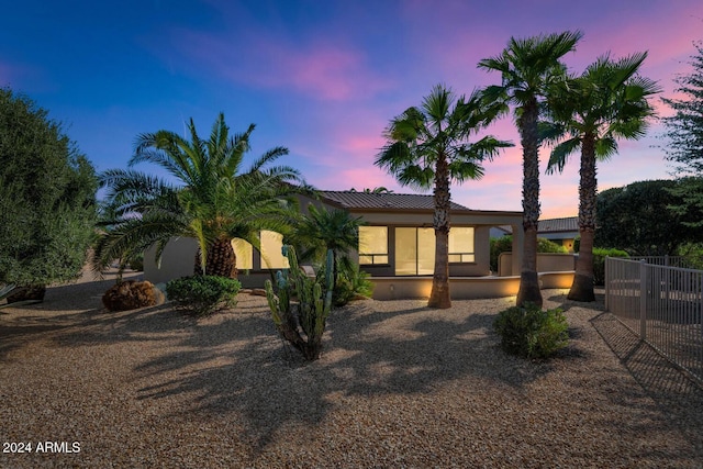 exterior space with fence and stucco siding