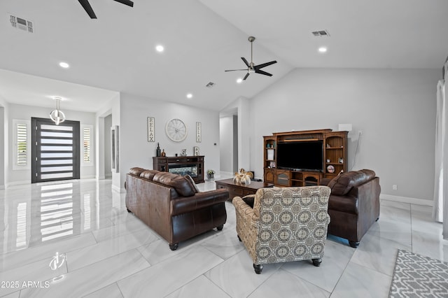 8017 S 143rd Ave, Goodyear, AZ 85338 - living area featuring ceiling fan, lofted ceiling, recessed lighting, and light marble finish floors