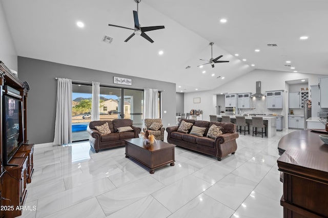 8017 S 143rd Ave, Goodyear, AZ 85338 - living room featuring a ceiling fan, high vaulted ceiling, and recessed lighting