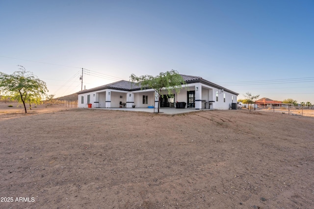 8017 S 143rd Ave, Goodyear, AZ 85338 - view of front of house with a patio area, stucco siding, and a tiled roof