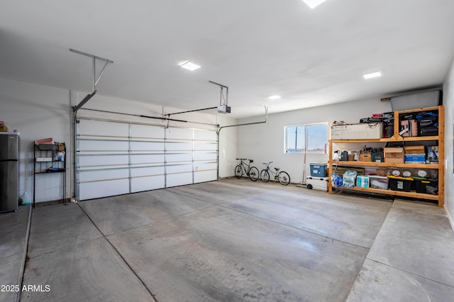 8017 S 143rd Ave, Goodyear, AZ 85338 - garage with a garage door opener and freestanding refrigerator