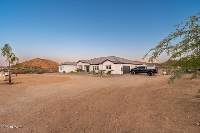 8017 S 143rd Ave, Goodyear, AZ 85338 - single story home featuring an attached garage, driveway, and a mountain view