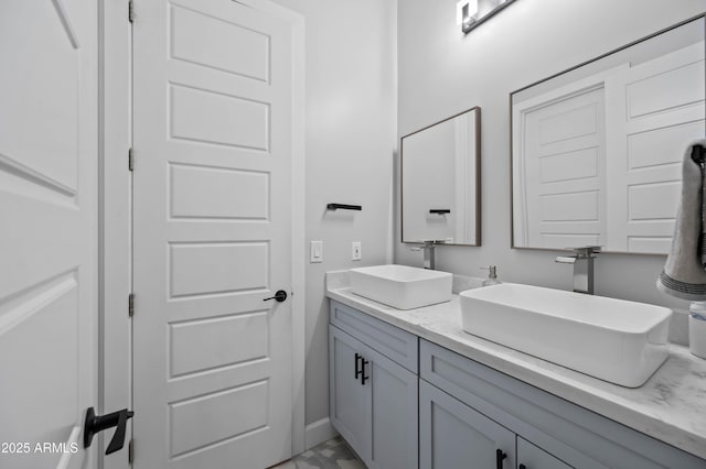 8017 S 143rd Ave, Goodyear, AZ 85338 - bathroom featuring double vanity and marble finish flooring