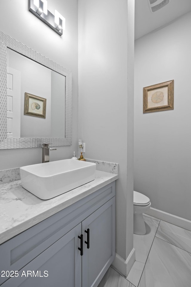 8017 S 143rd Ave, Goodyear, AZ 85338 - bathroom with vanity and marble look tiles