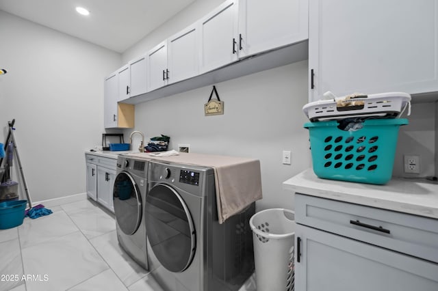 8017 S 143rd Ave, Goodyear, AZ 85338 - washroom featuring independent washer and dryer, cabinet space, light marble finish flooring, and recessed lighting