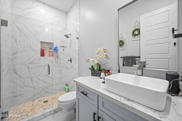 8017 S 143rd Ave, Goodyear, AZ 85338 - bathroom featuring a stall shower, vanity, and marble finish floors